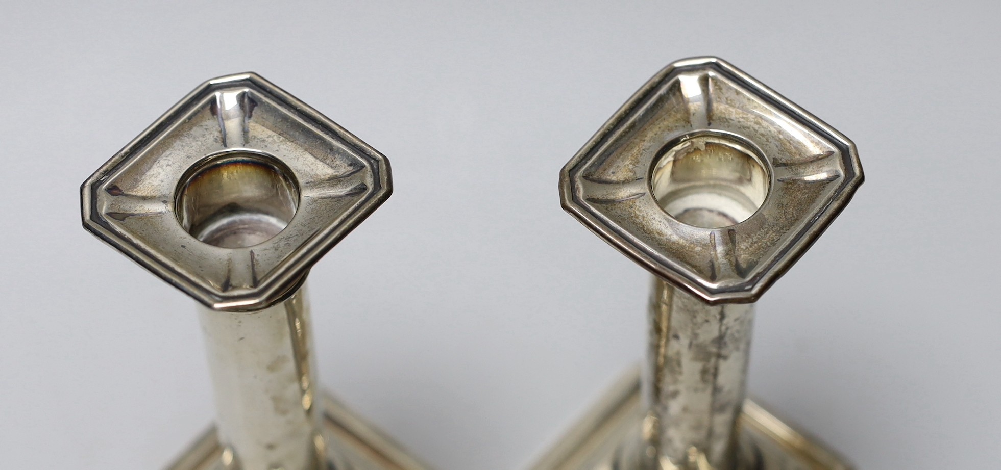 A pair of George V silver mounted dwarf candlesticks, James Dixon & Sons, Sheffield, 1913, 13.8cm, weighted.